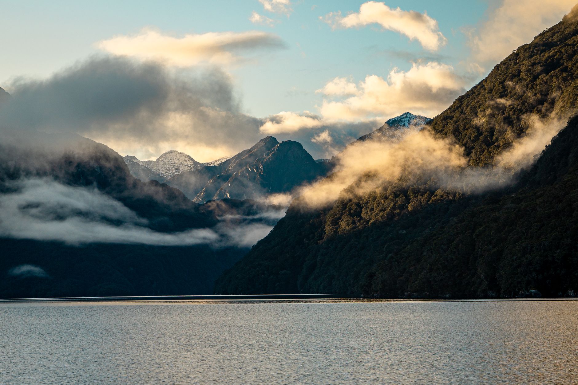 Fiordland rainforest lake and mountains